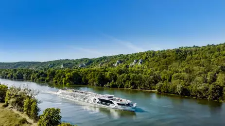 The Jane Austin luxury cruise boat from Riviera sailing down the Douro with blue skies