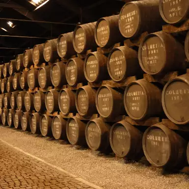 Stacks of port wine barrels in cellar at Graham's Port Lodge in Portugal