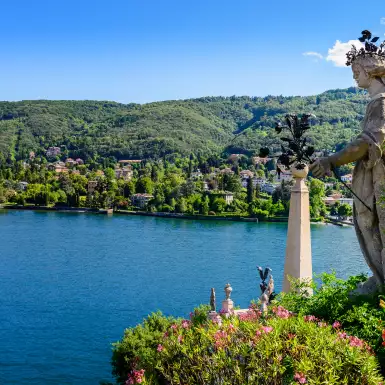 Isola Bella island and Lake Maggiore with statue and garden in Italy