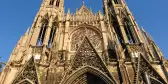 Low angle perspective of a large Gothic Catholic church with a clear blue sky, Saint-Ouen Abbey, Rouen