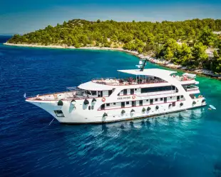 image of the new MS Equator yacht in the blue turquoise waters of a bay in croatia