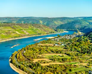The great loop of the Rhine at Boppard in Germany, bright blue waters and hills in the distance.