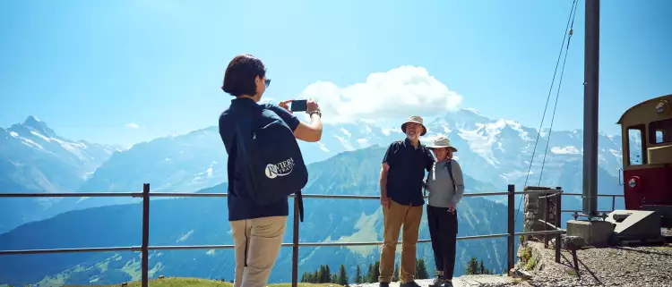 Riviera Tour Manager taking couples photo in Switzerland