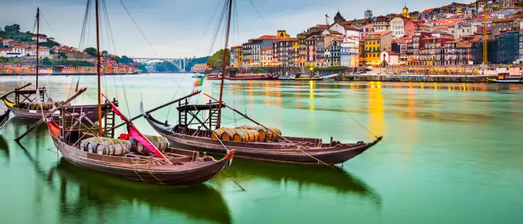 Porto cityscape on the Douro River with traditional Rabelo boats in Portugal